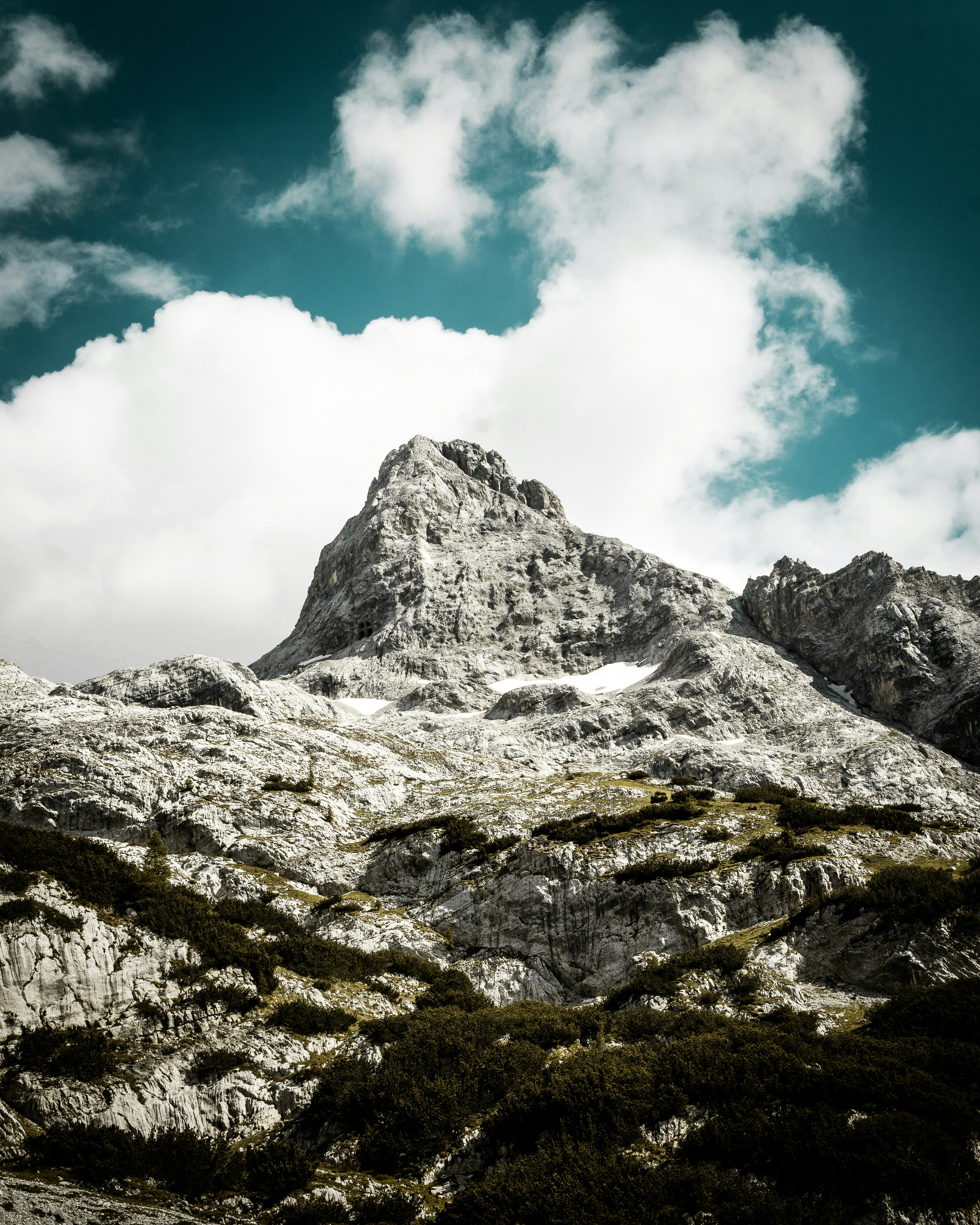 gray mountain across white cloud